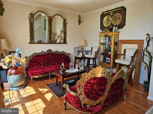 a living room filled with furniture and wooden floor