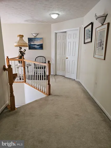 a bedroom with bed and a chandelier