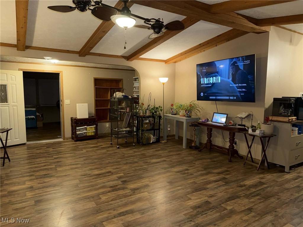 56 3rd Street Rayland, OH 43943 - Photo 37 of 46 Living room featuring arched walkways, dark wood finished floors, beamed ceiling, and ceiling fan