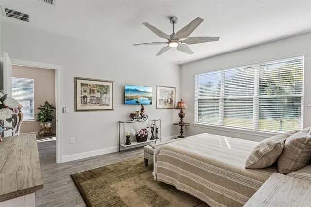 a living room with furniture a rug and a window