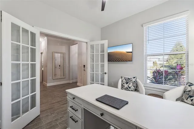 a kitchen with kitchen island a large counter top space appliances and cabinets