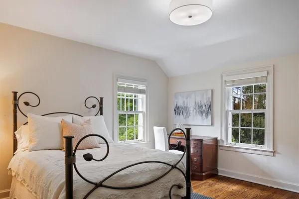 a picture of a livingroom with furniture and windows