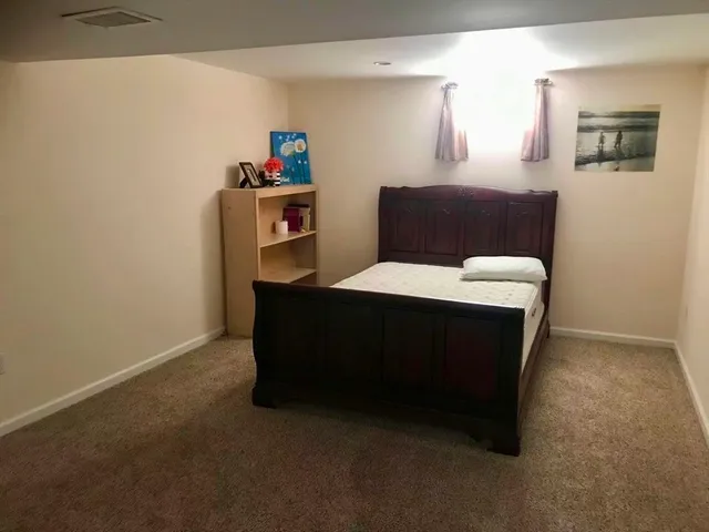 a room with a bed and a table in it