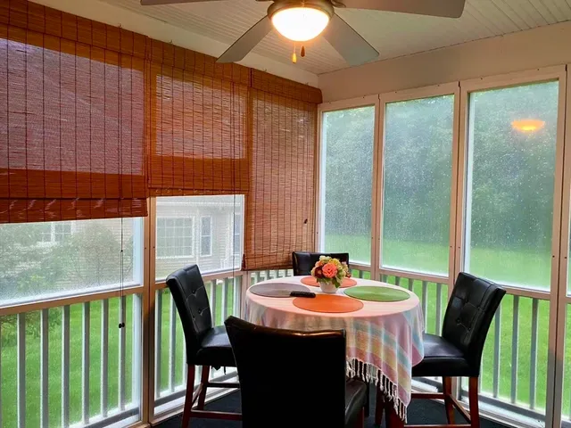 a dining room with furniture and window