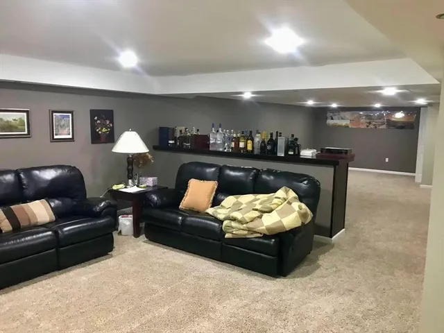 a living room with furniture and a couch