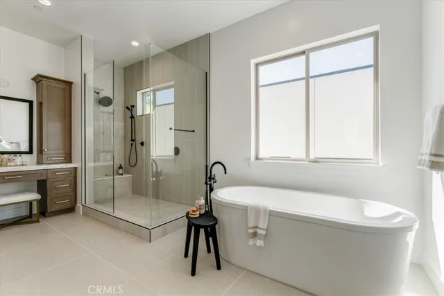 a bathroom with a granite countertop sink a toilet and shower