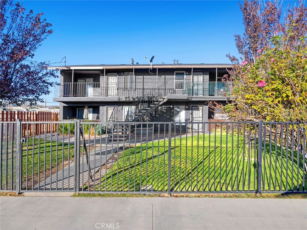 38423 10th Place East, Unit 3 Palmdale, CA 93550 - Photo 1 of 27 a view of a house with a balcony
