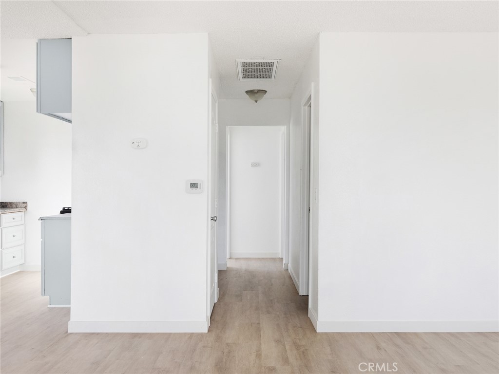 38423 10th Place East, Unit 3 Palmdale, CA 93550 - Photo 15 of 27 a view of a hallway with closet