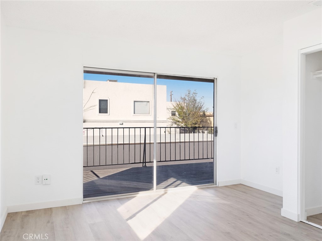 38423 10th Place East, Unit 3 Palmdale, CA 93550 - Photo 19 of 27 a view of a room with wooden floor