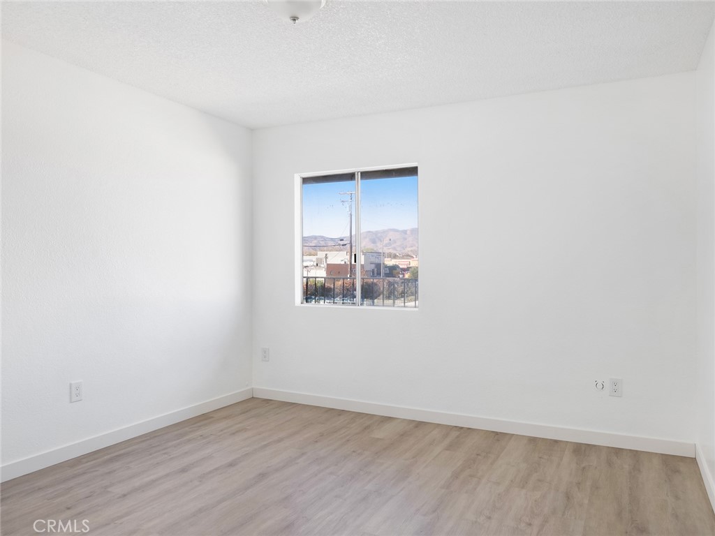 38423 10th Place East, Unit 3 Palmdale, CA 93550 - Photo 22 of 27 an empty room with a window