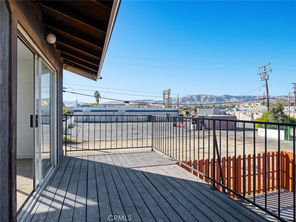 38423 10th Place East, Unit 3 Palmdale, CA 93550 - Photo 26 of 27 a view of balcony with wooden floor