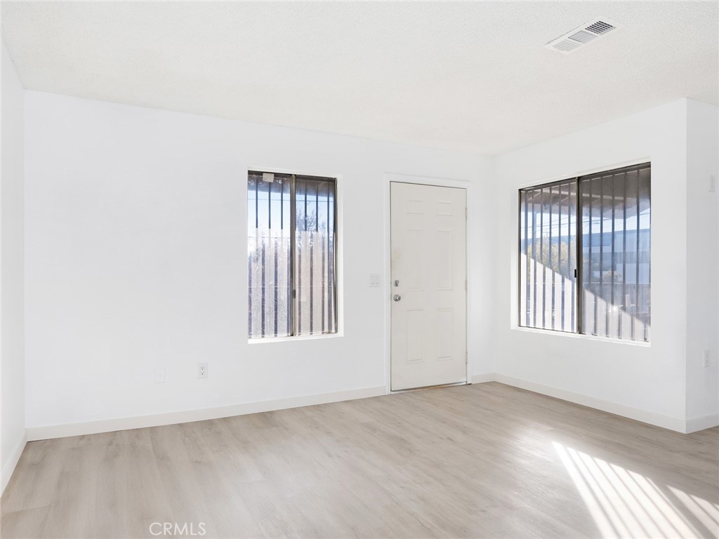 38423 10th Place East, Unit 3 Palmdale, CA 93550 - Photo 5 of 27 an empty room with windows