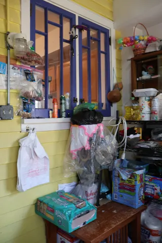 a living room filled with furniture and a floor to ceiling window or kitchen