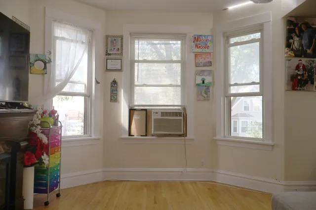 a view of a house with pool and windows