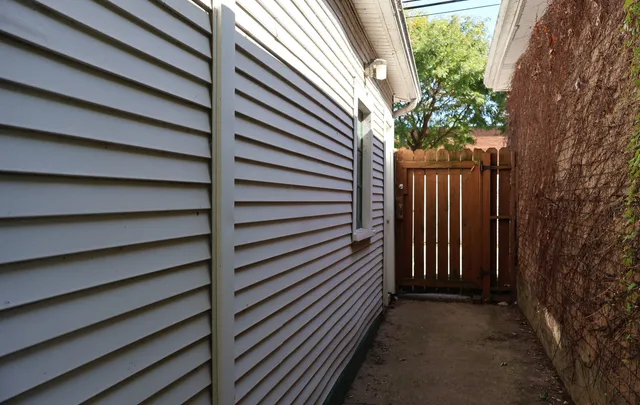 a view of a house with a tree