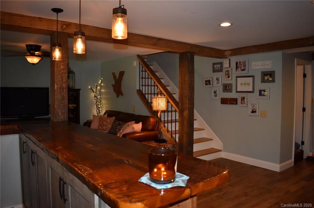 91 Country Club Road Tryon, NC 28782 - Photo 19 of 24 a view of entryway and hall with wooden floor