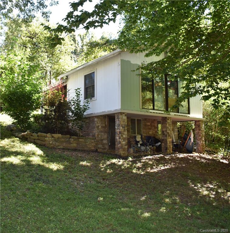 91 Country Club Road Tryon, NC 28782 - Photo 24 of 24 a front view of a house with a yard
