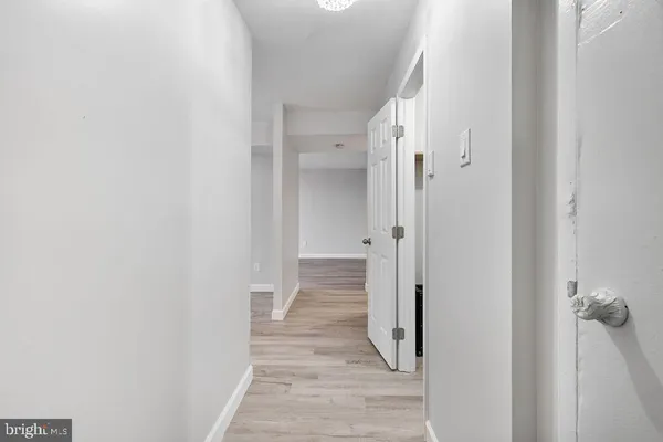 a view of a bathroom from a hallway