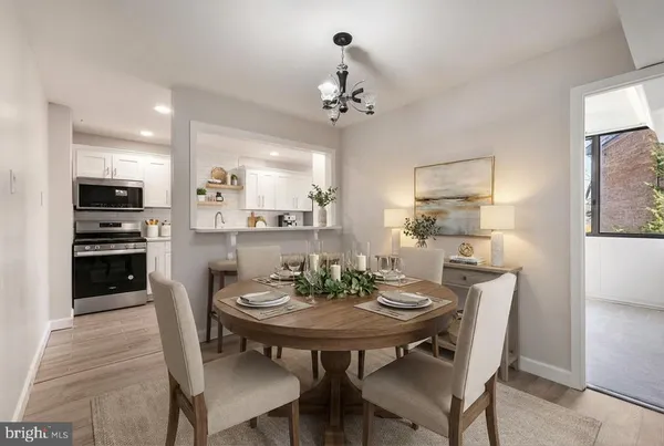 a view of a dining room with furniture and wooden floor