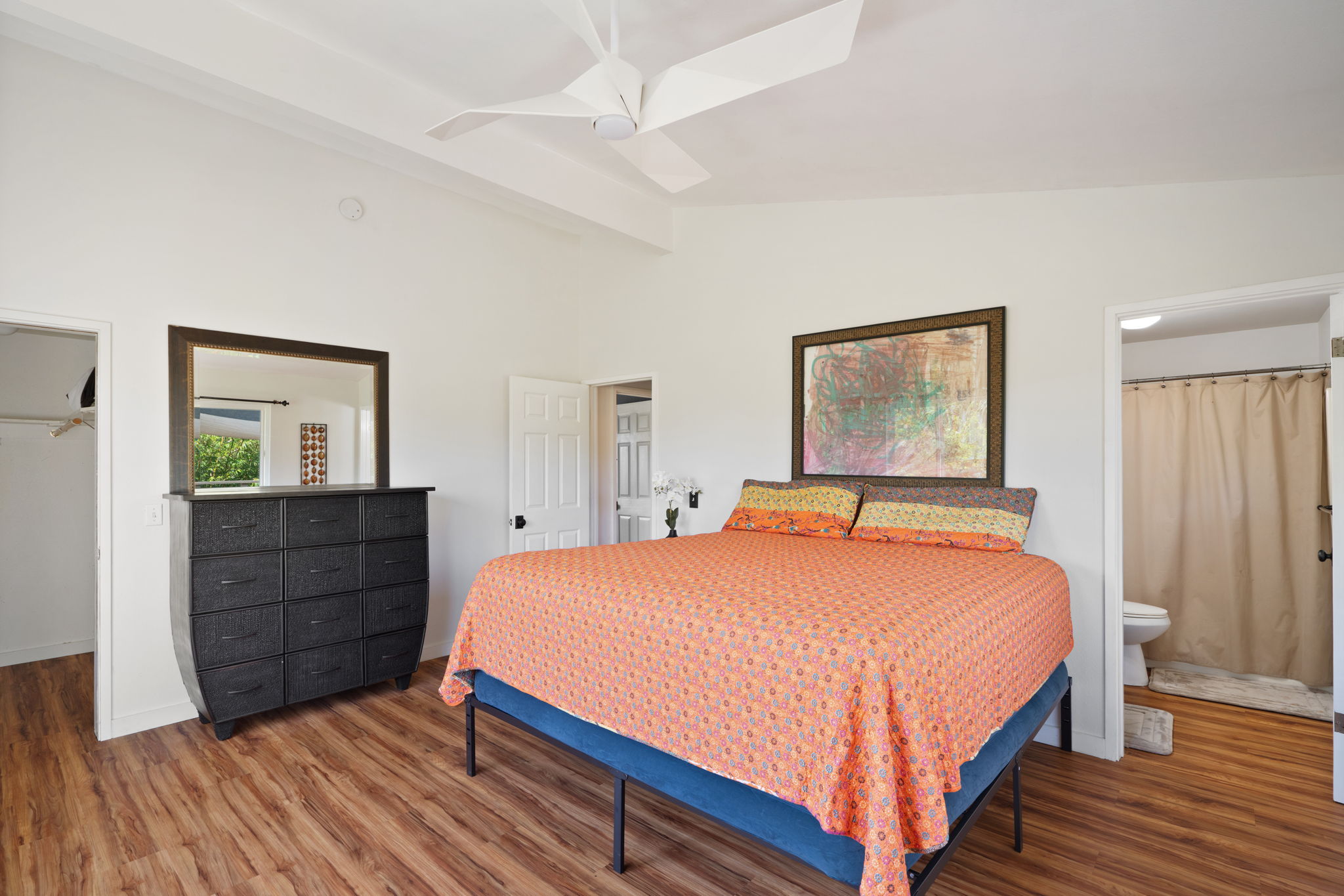 6100 Kawaihau Road Kapaa, HI 96746 - Photo 14 of 22 a bedroom with a bed and a dresser