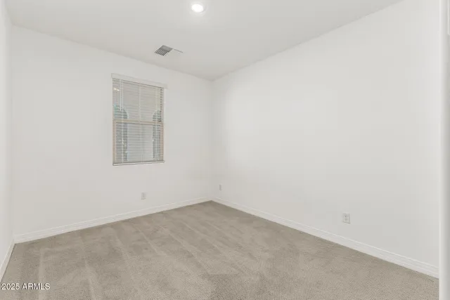 an empty room with a empty space and window