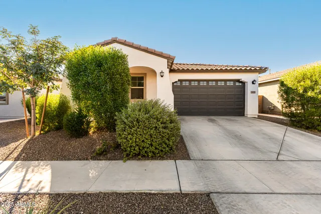 a view of a house with a small yard