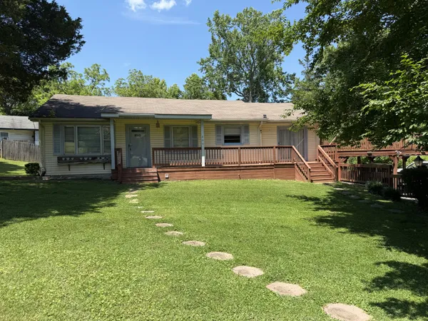 a view of a house with a yard porch and sitting area