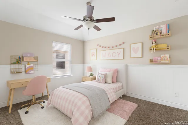 a bedroom with a bed a desk and chair with window