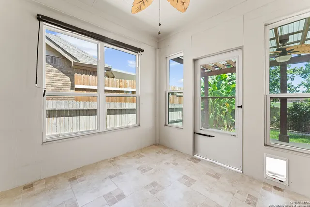 a building outdoor space with patio furniture and garden view