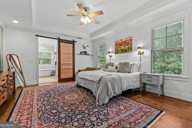 a en suite bathroom with a sink double vanity and a mirror