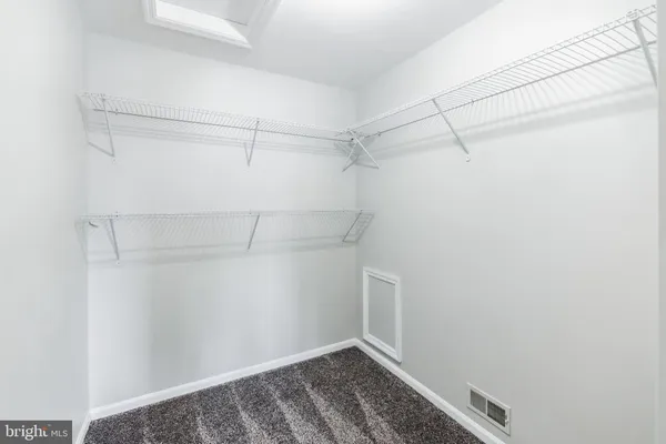 a view of a room with racks on the wall