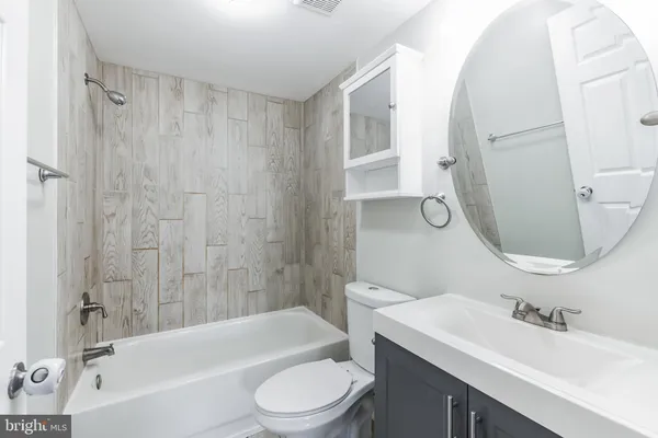 a bathroom with a toilet a sink and a bathtub