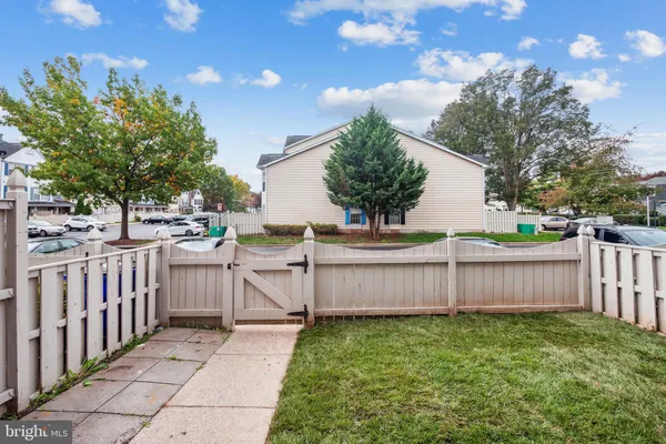 a view of a backyard with sitting area