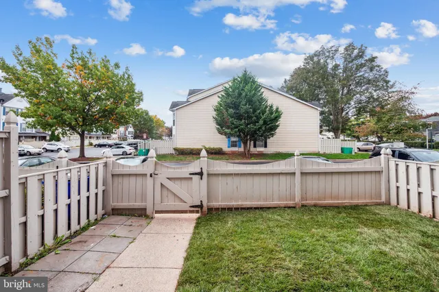 a view of a backyard with sitting area