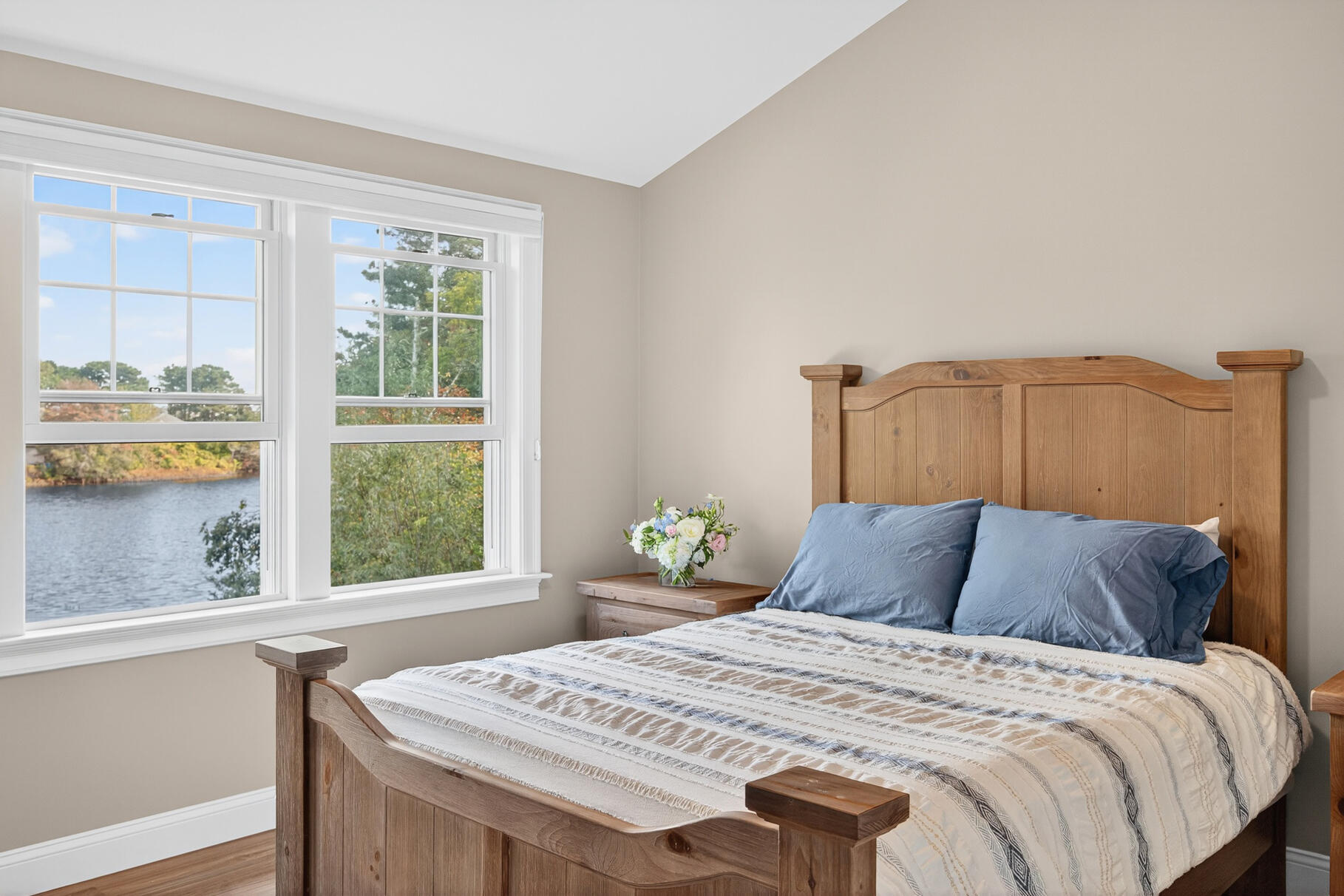 128 Uncle Percy's Road Mashpee, MA 02649 - Photo 28 of 45 a bedroom with a bed and a window