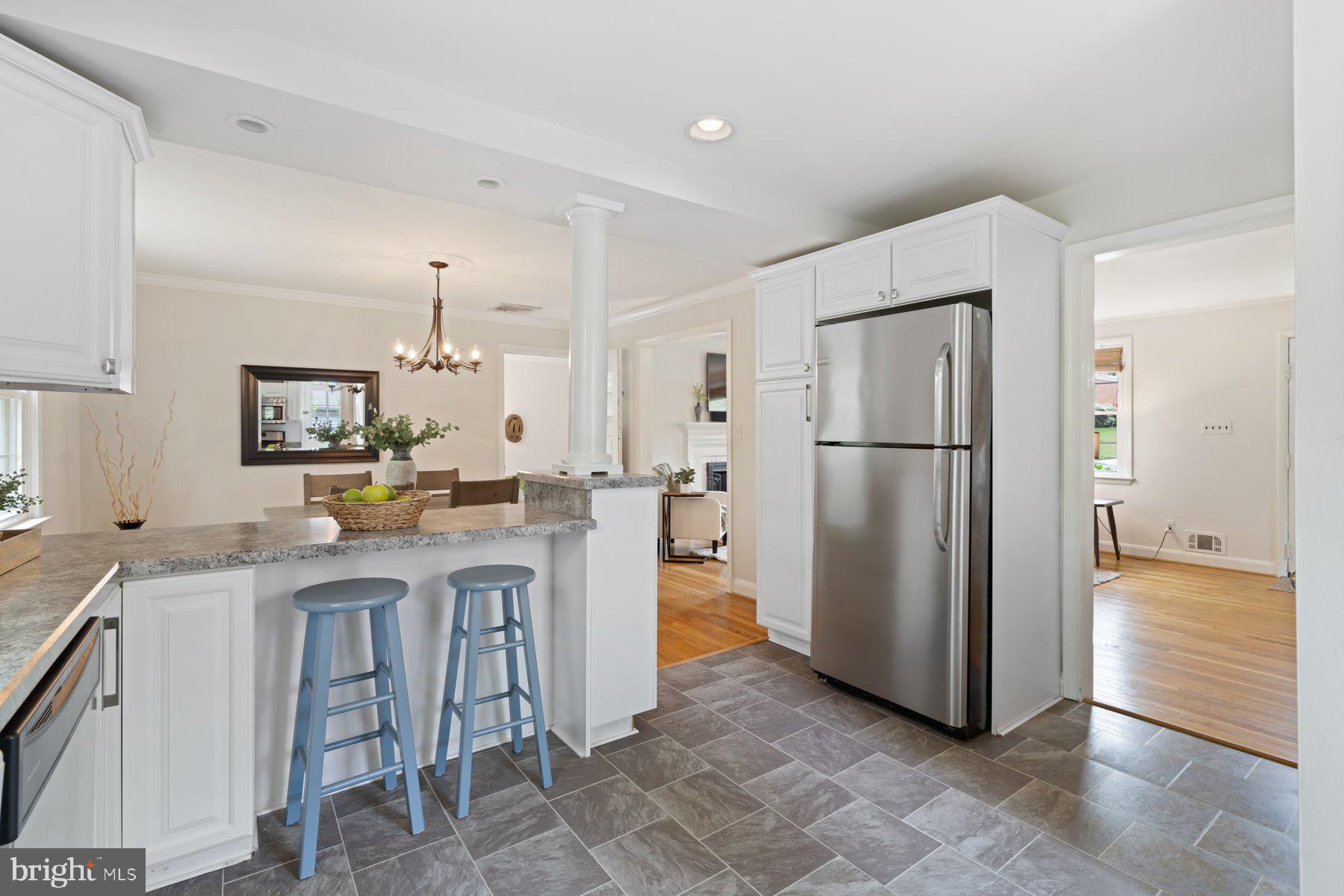 540 Brook Road Towson, MD 21286 - Photo 13 of 37 a kitchen with stainless steel appliances granite countertop a refrigerator and a stove top oven