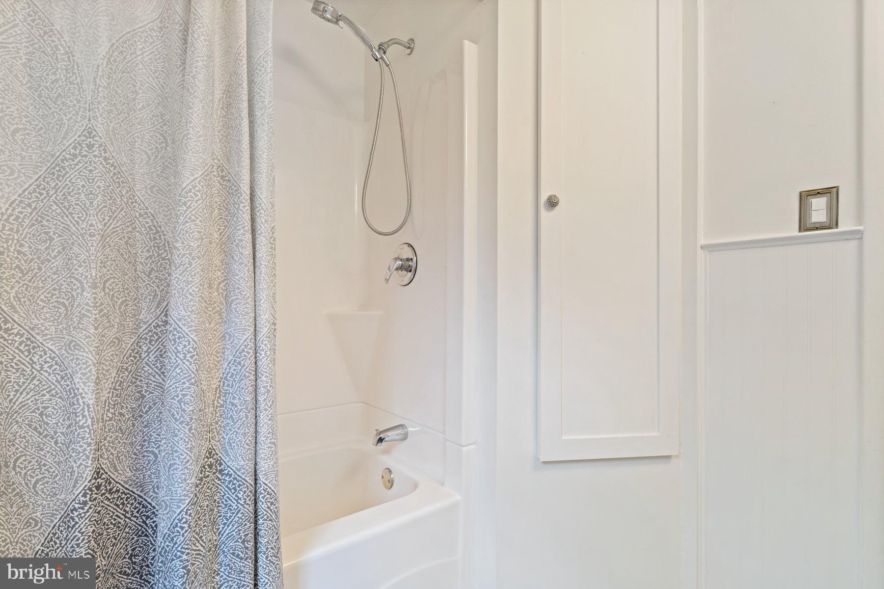 540 Brook Road Towson, MD 21286 - Photo 21 of 37 a bathroom with a shower and a bath tub