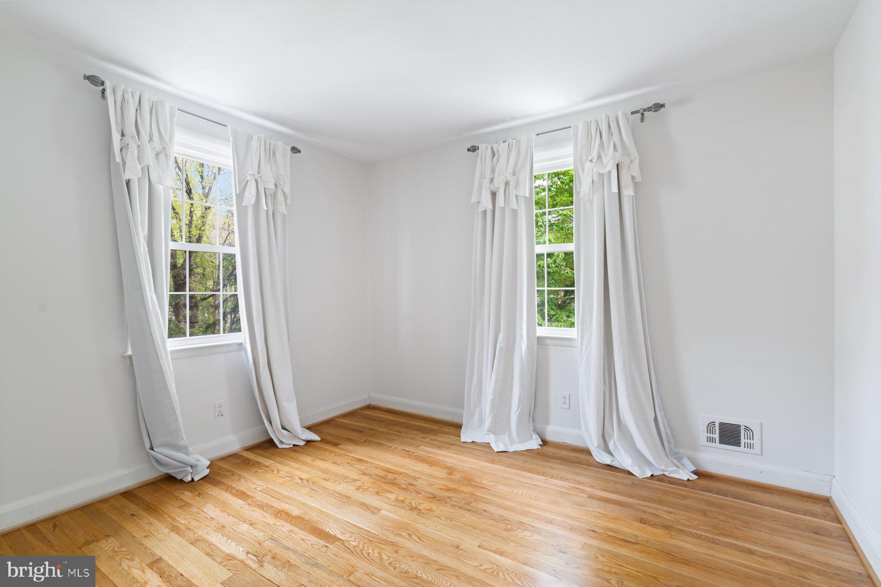 540 Brook Road Towson, MD 21286 - Photo 24 of 37 a view of an empty room with wooden floor and a window