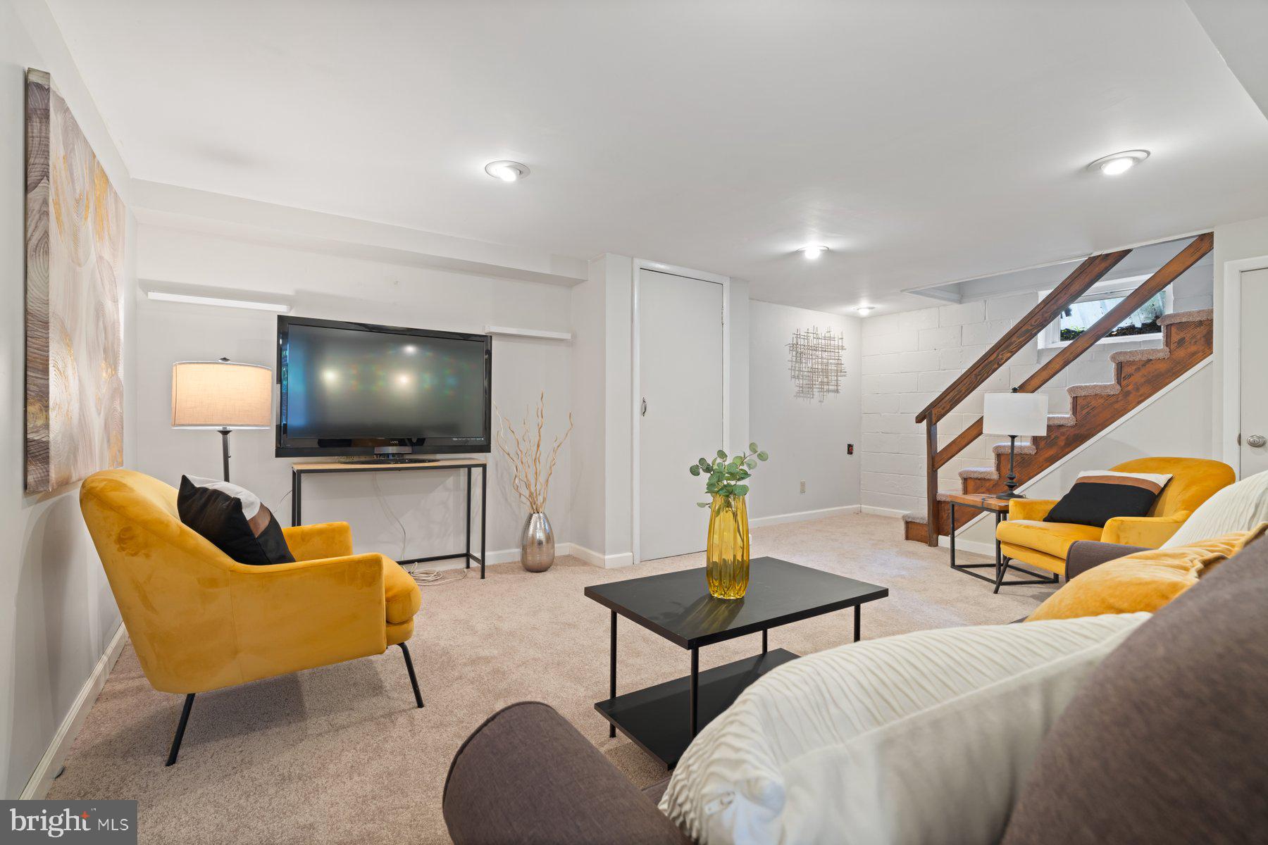 540 Brook Road Towson, MD 21286 - Photo 27 of 37 a living room with furniture and a flat screen tv