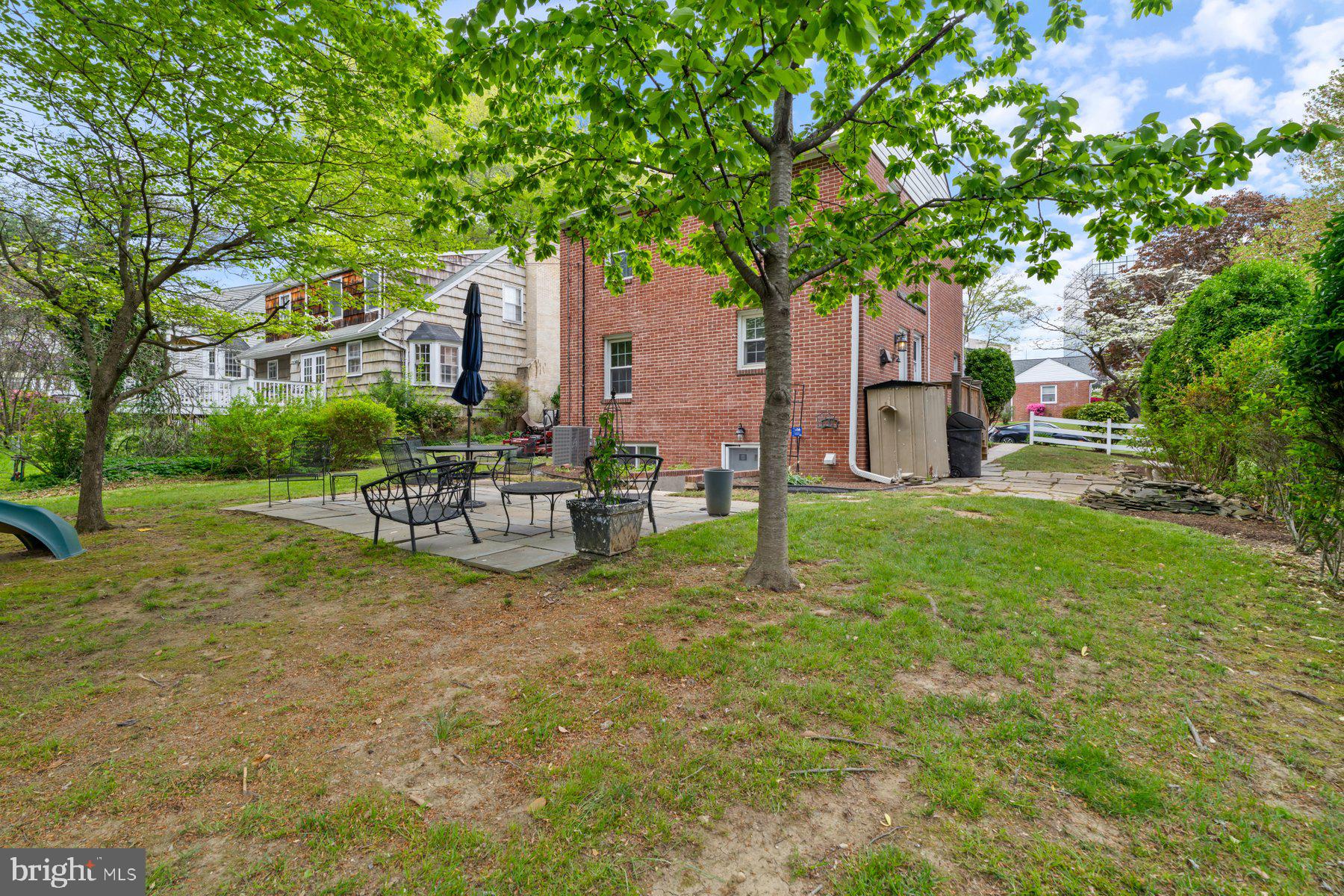 540 Brook Road Towson, MD 21286 - Photo 34 of 37 a white house with a big yard and large trees