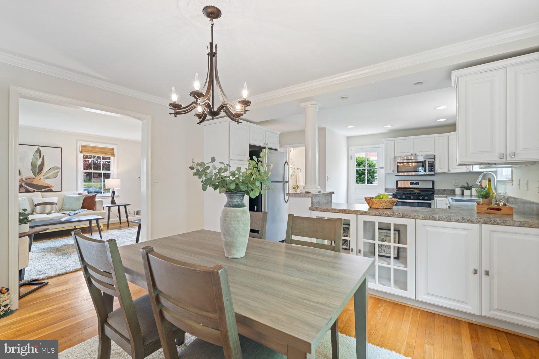540 Brook Road Towson, MD 21286 - Photo 8 of 37 a dining room filled chandelier and kitchen view
