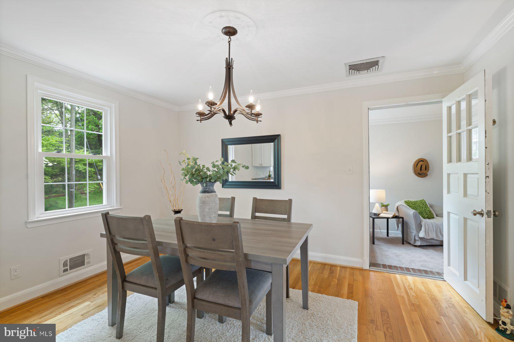 540 Brook Road Towson, MD 21286 - Photo 10 of 37 a view of a dining room with furniture window and wooden floor