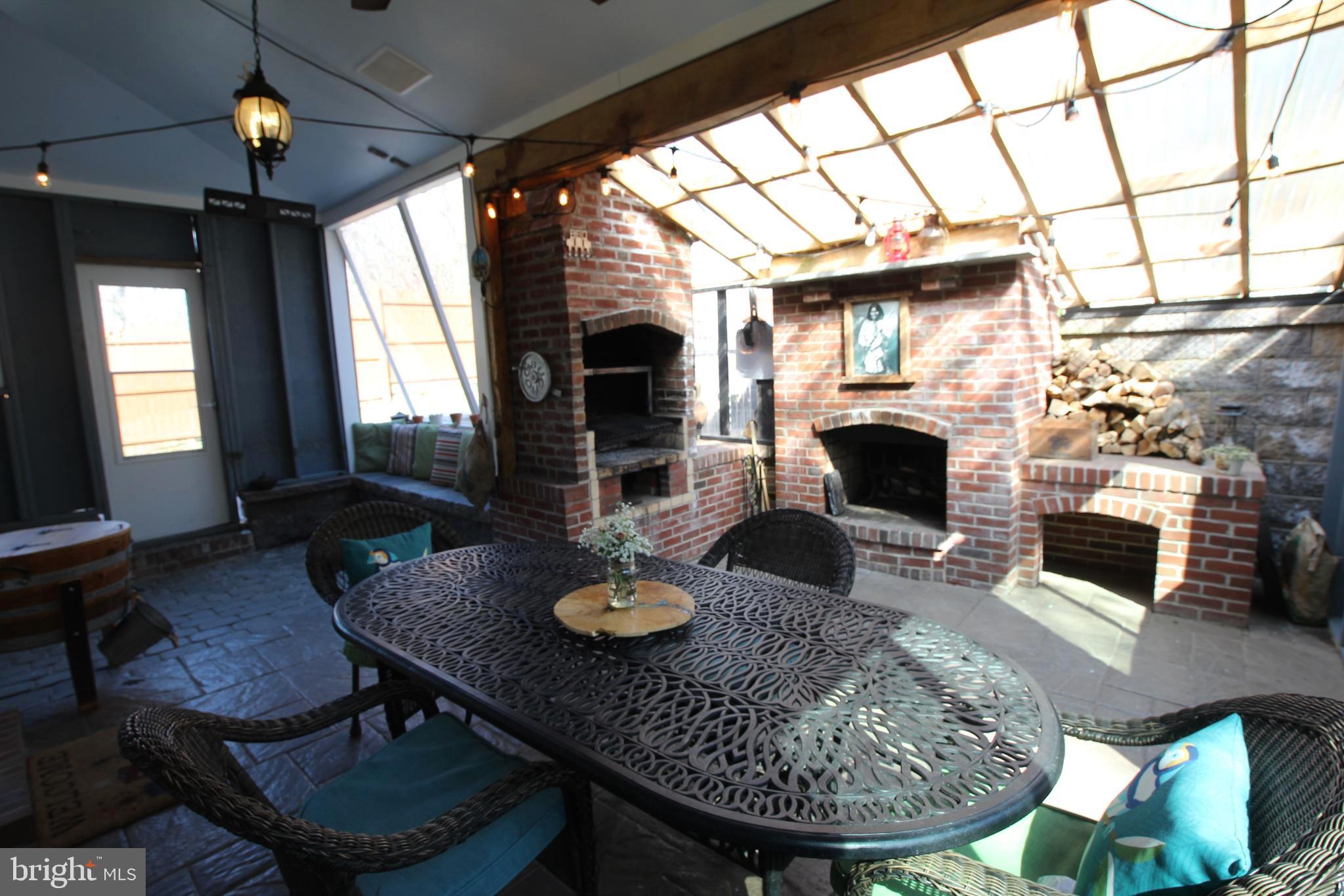 512 North Mill Road Kennett Square, PA 19348 - Photo 32 of 38 Enclosed Patio with Heater and Fireplace