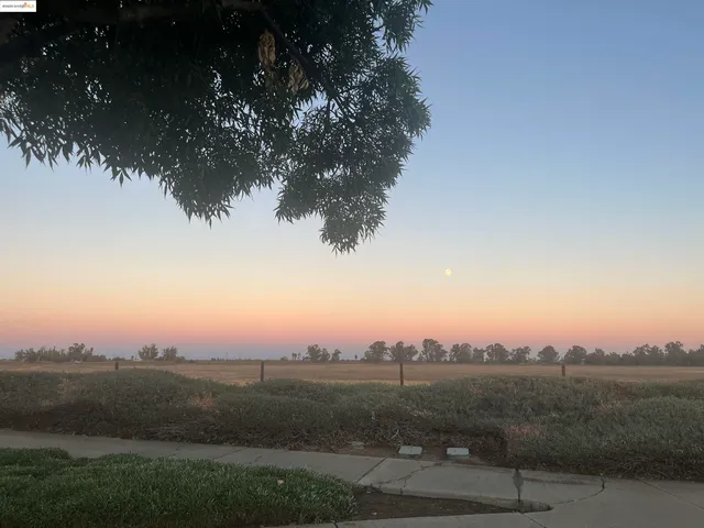 a view of mountain with sunset view