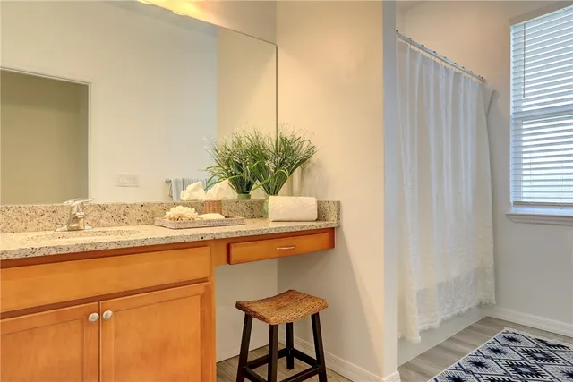 a room with a sink and a mirror