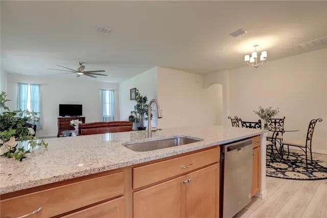 a kitchen with sink and window