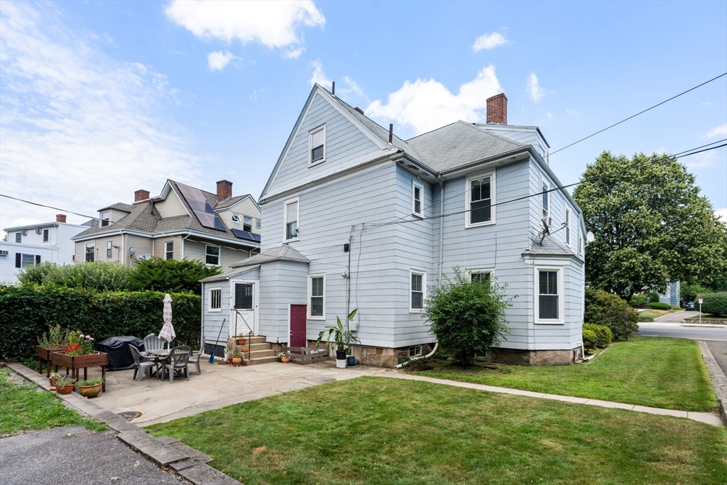 69 Chestnut Hill Avenue Boston, MA 02135 - Photo 5 of 32 a view of a house with a yard
