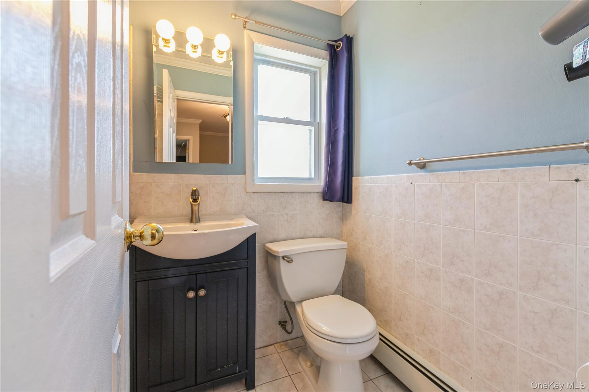 92 Cardinal Lane, Unit 92 Islip, NY 11751 - Photo 14 of 36 a bathroom with a granite countertop sink toilet and mirror