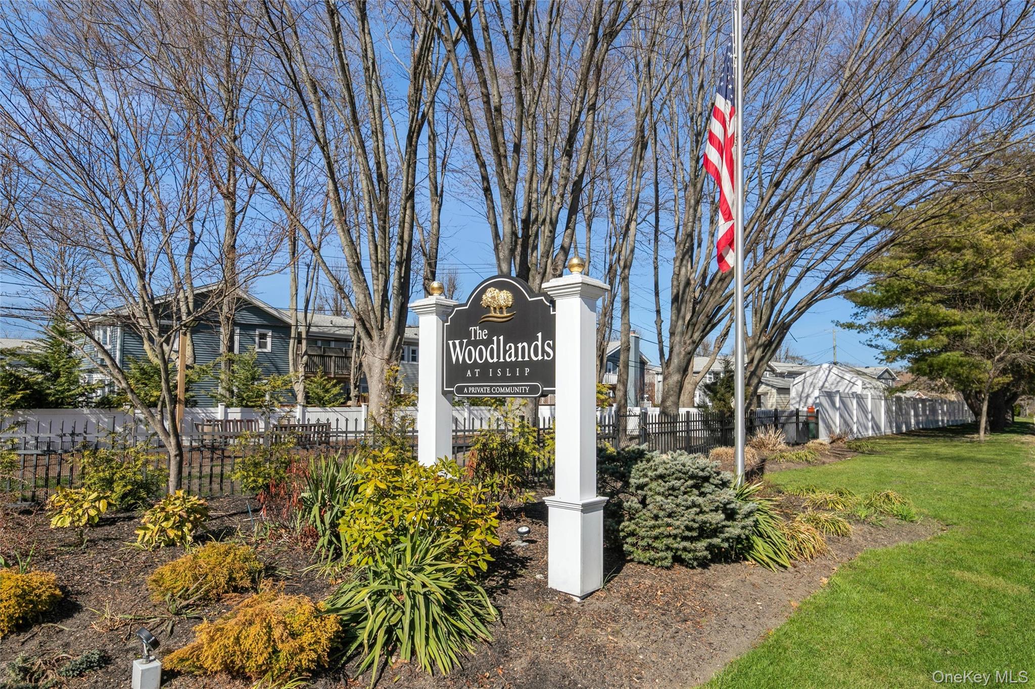 92 Cardinal Lane, Unit 92 Islip, NY 11751 - Photo 22 of 36 a sign on the side of a building