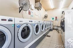 92 Cardinal Lane, Unit 92 Islip, NY 11751 - Photo 35 of 36 a utility room with dryer and washer